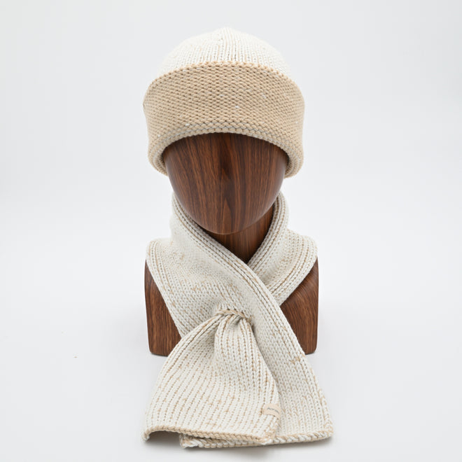 A mannequin wearing a marbled Cuffed Toque in Camaro Sam. The Toque features a silver bean at the crown. This is shown here with a matching Ascot Scarf.