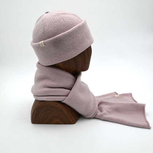 A Cuffed Dusty Pink Beanie and Classic Scarf on a mannequin