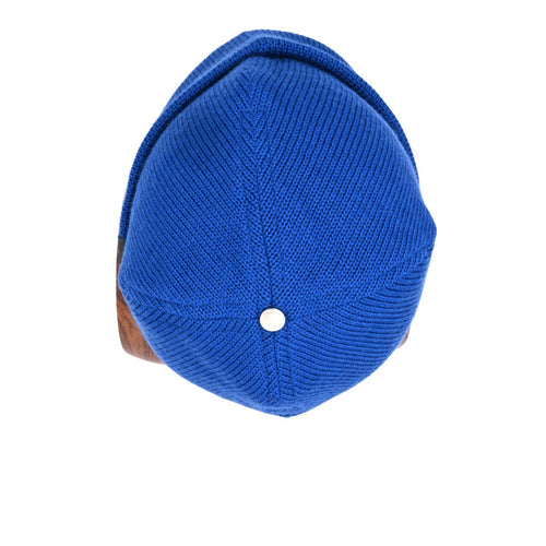 a top view wanaka cuffed beanie in azure blue with a silver bean