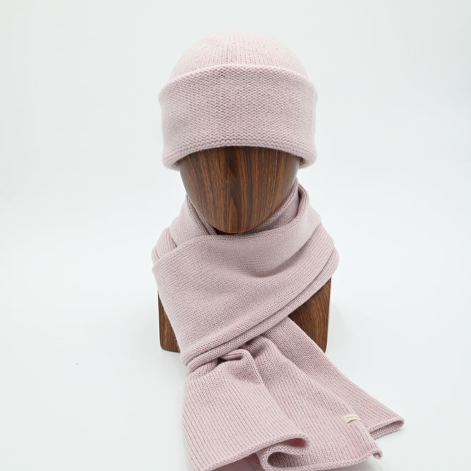 Egmont Beanie and matching scarf in Dusty Pink. The Beanie features a silver bean at the crown. This is shown here with a matching Classic Scarf.