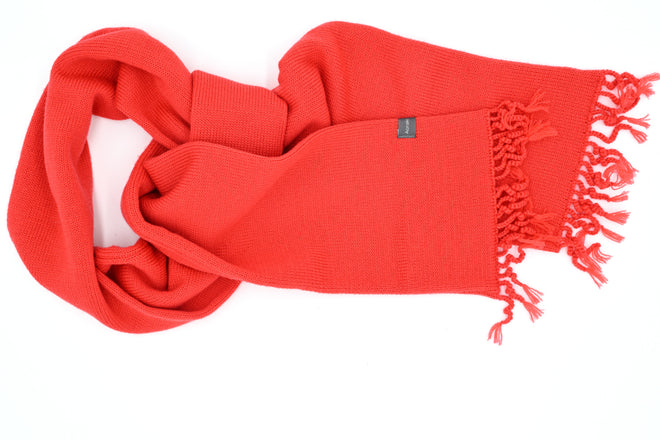 A Wanaka Fringe Scarf in Poppy. Featuring a distinctive tassel fringe