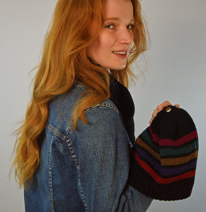 A model is wearing a Stripe No1 Francoise classics beanie paired with a black scarf.