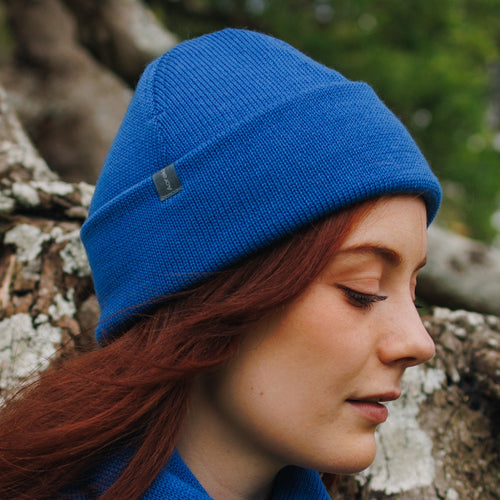 A modal wearing a Azure Blue Cuffed Felted Wanaka Toque and matching Fringed Scarf