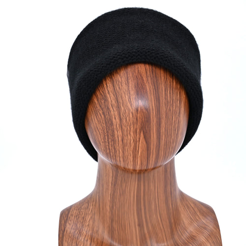 Ebony Cashmere beanie on a wooden mannequin Bust against a white background