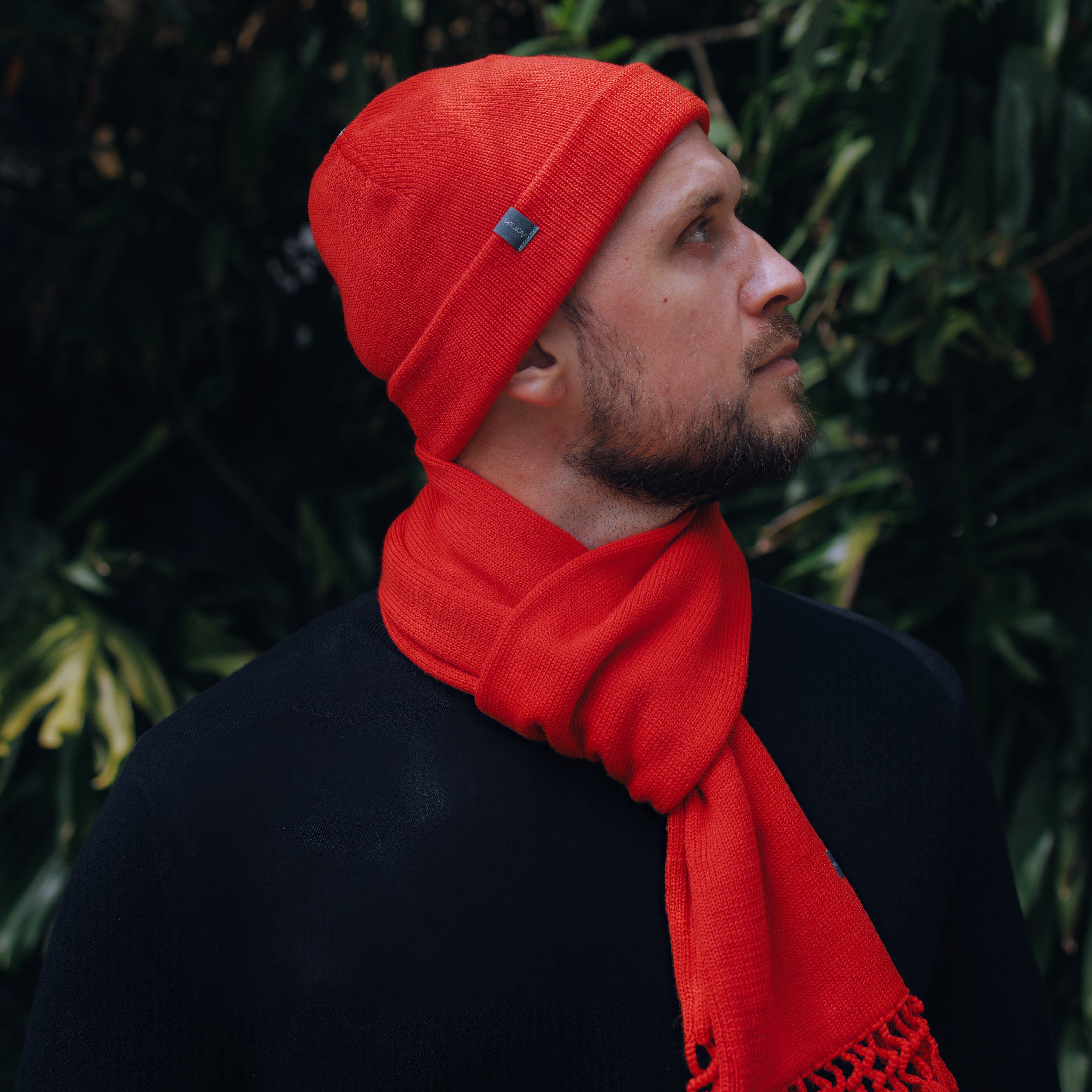 Bean in vibrant Poppy Cuffed Toque with matching Tassel Scarf