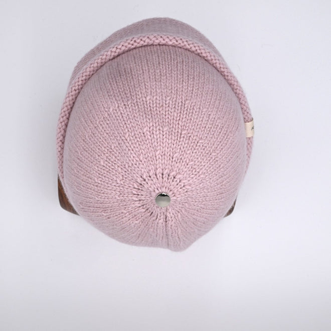 Top view of Dusty Pink Egmont Cuffed Beanie with a silver bean on the crown