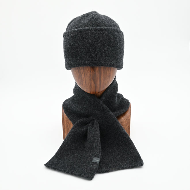 Mannequin wearing a Gunmetal Sub-21 felted Toque and matching Ascot Scarf.  Both made of lambswool.